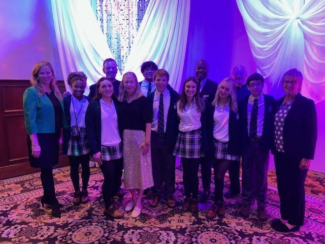 Students with Siafa Lewis at Catholic Charities Dinner